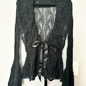 Black knit cardigan with flutter sleeve, lace tie in front